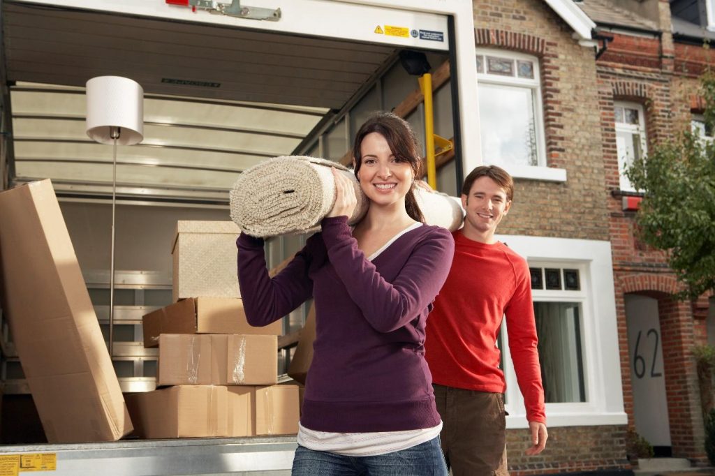 A man and a woman moving in their new Toronto home