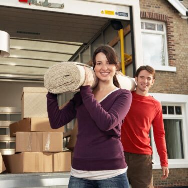 A man and a woman moving in their new Toronto home